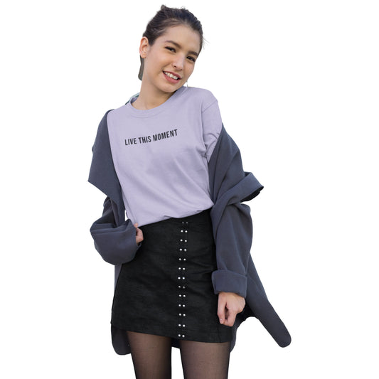 Woman wearing a gray sweater with text and a black skirt on a white background