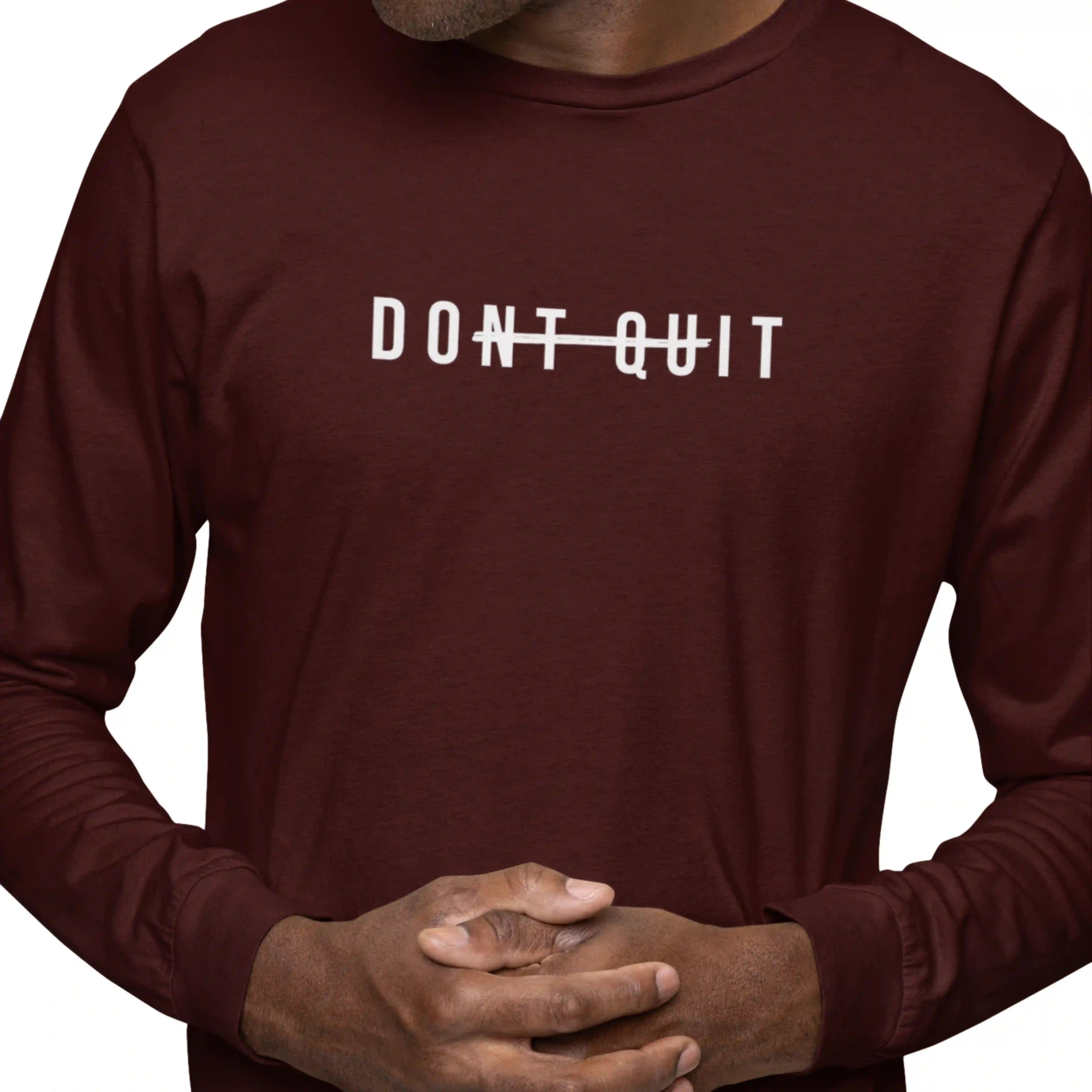 Maroon long-sleeve shirt with 'DON'T QUIT' text on a white background