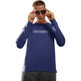 Person wearing a blue long-sleeve shirt with 'ZERO REGRETS' text on a white background