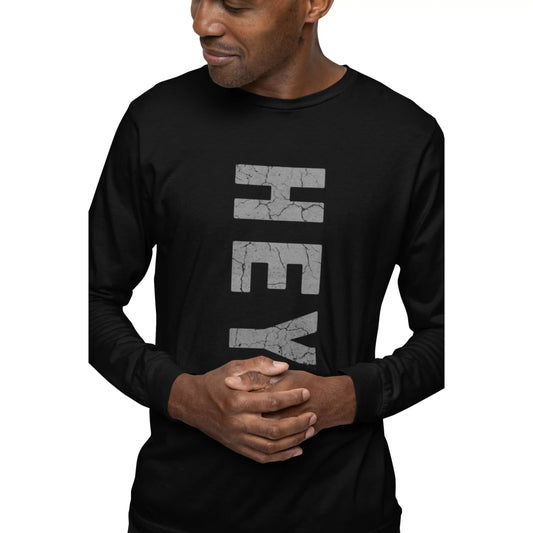 Man wearing a black long-sleeve shirt with 'HEY' printed on it against a white background