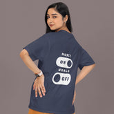 Person wearing a navy blue t-shirt with 'Music On World Off' text on the back, standing against a plain background.
