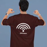 Person wearing a brown t-shirt with a Wi-Fi symbol and 'Always Online' text on the back, against a plain background.