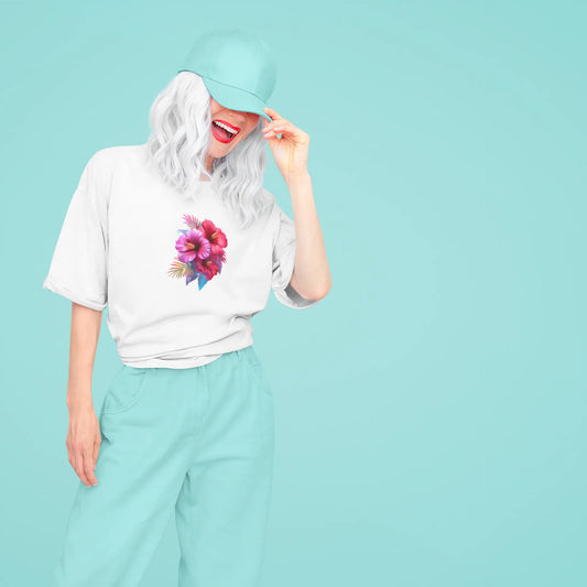 Person wearing a white t-shirt with a colorful flower design on a light blue background