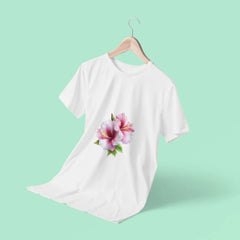 White t-shirt with a floral design on a hanger against a light green background
