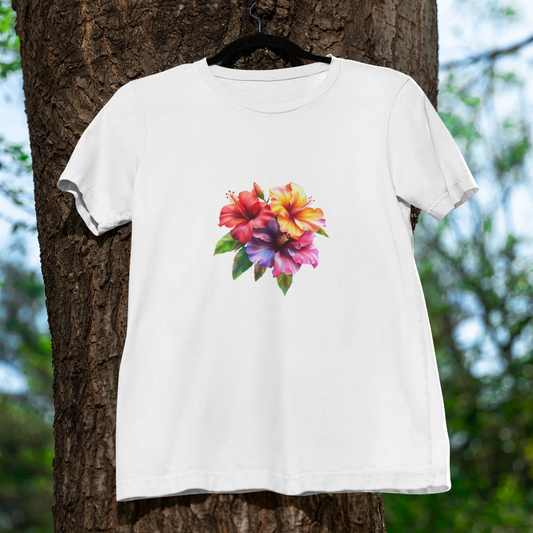 White t-shirt with a colorful floral design hanging on a tree