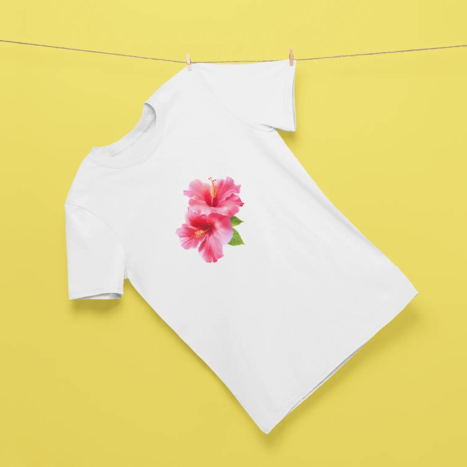 White long-sleeve shirt with a pink flower design on a yellow background