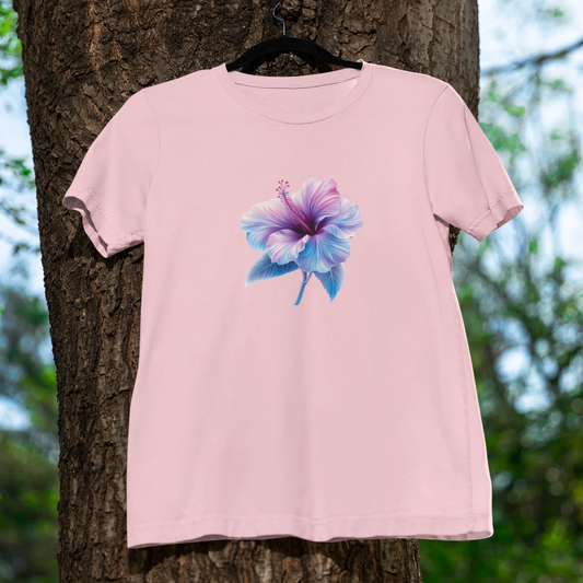 Pink t-shirt with a floral design hanging on a tree