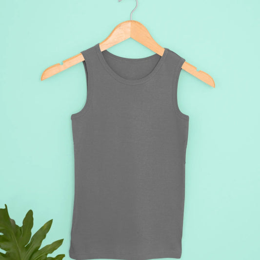 Gray tank top on a wooden hanger against a light blue background with green leaves.