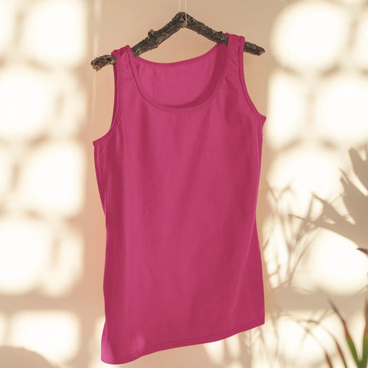Pink tank top hanging on a hanger with a blurred background