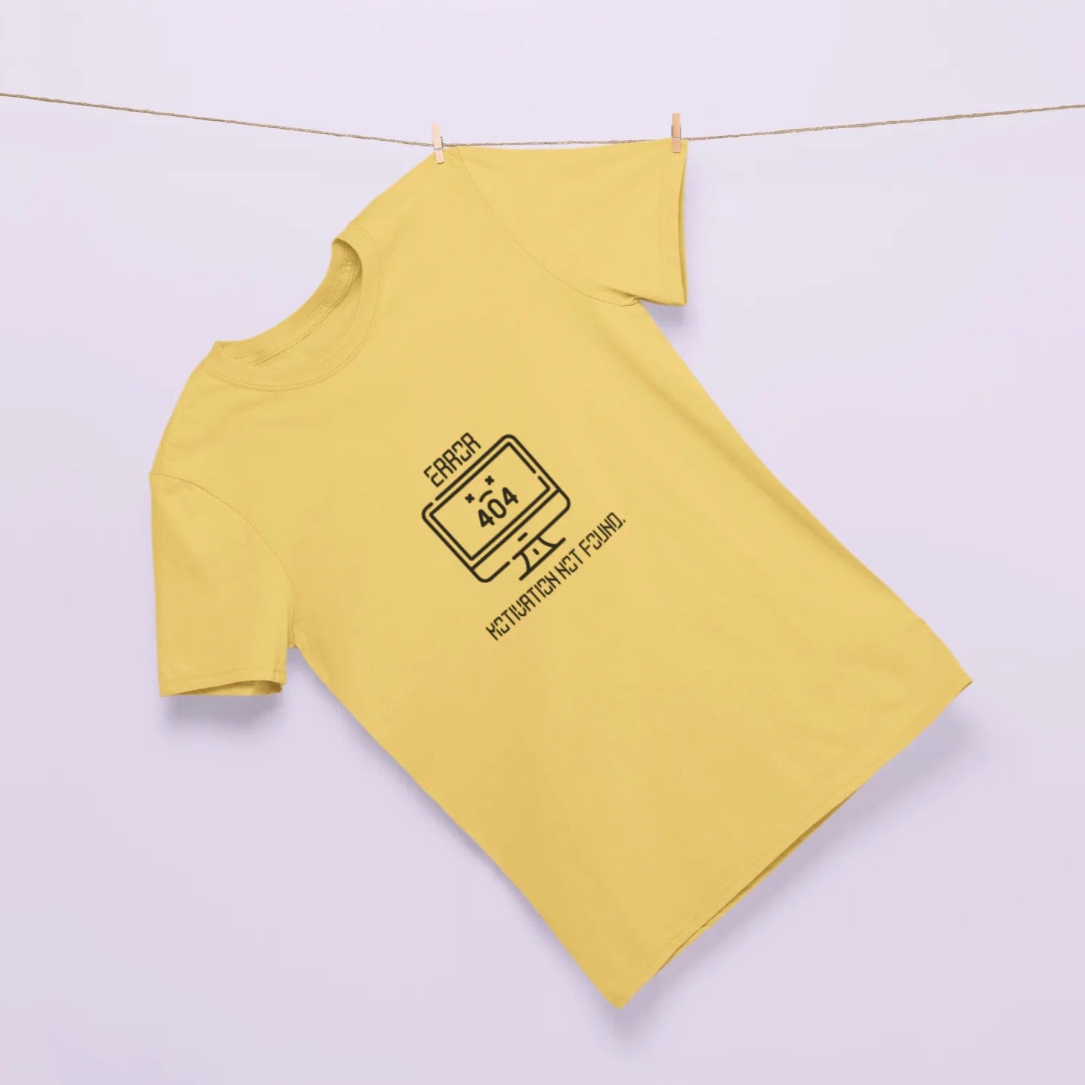 Yellow long-sleeve shirt with a black graphic on a light purple background