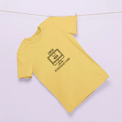 Yellow long-sleeve shirt with a black graphic on a light purple background