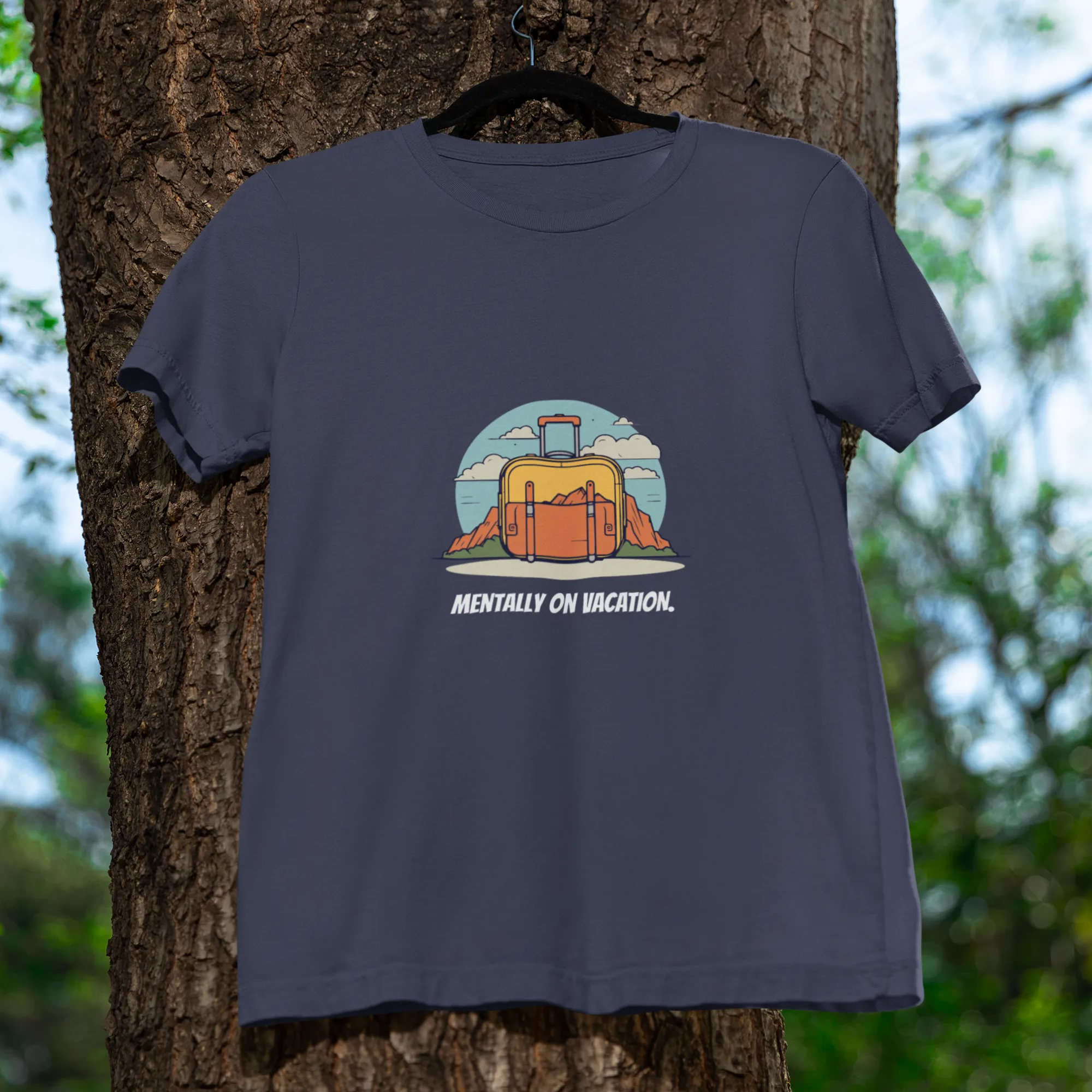 Navy blue t-shirt with a graphic design hanging on a tree