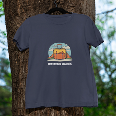 Navy blue t-shirt with a graphic design hanging on a tree