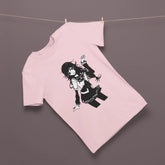 Pink sweatshirt with black graphic of a person hanging on a clothesline against a dark background