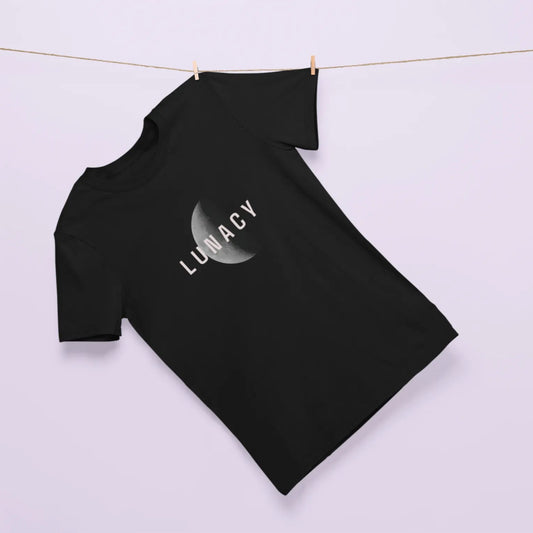 Black t-shirt with 'Lunacy' design hanging on a line against a light background