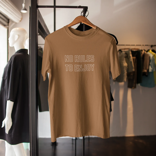 Brown t-shirt with 'No Rules to Enjoy' text on a hanger in a clothing store.