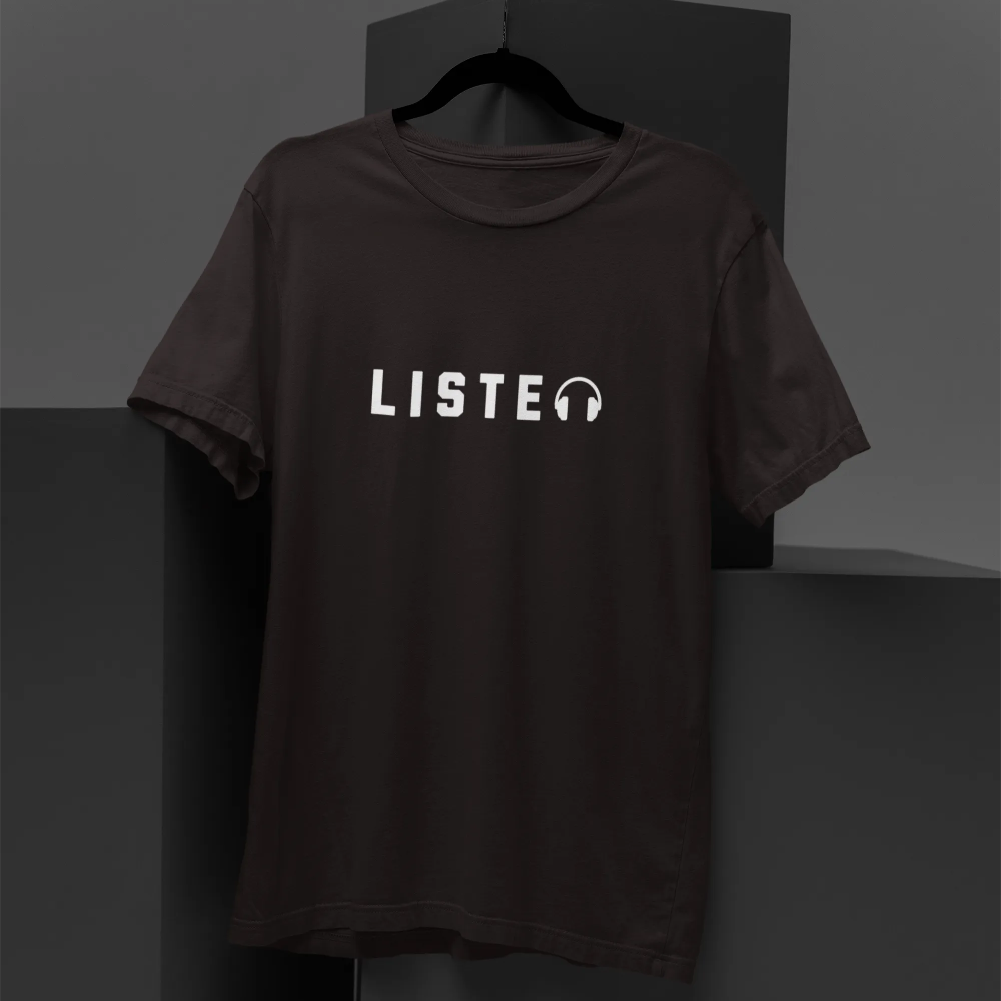 Black t-shirt with 'LISTEN' text on a dark background