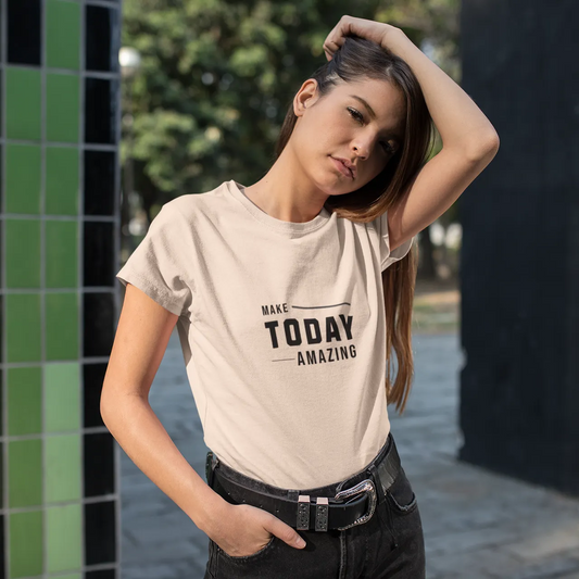 Woman wearing a t-shirt with 'Make Today Amazing' text in an outdoor setting.