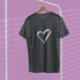 Black t-shirt with a white heart design on a hanger against a purple background