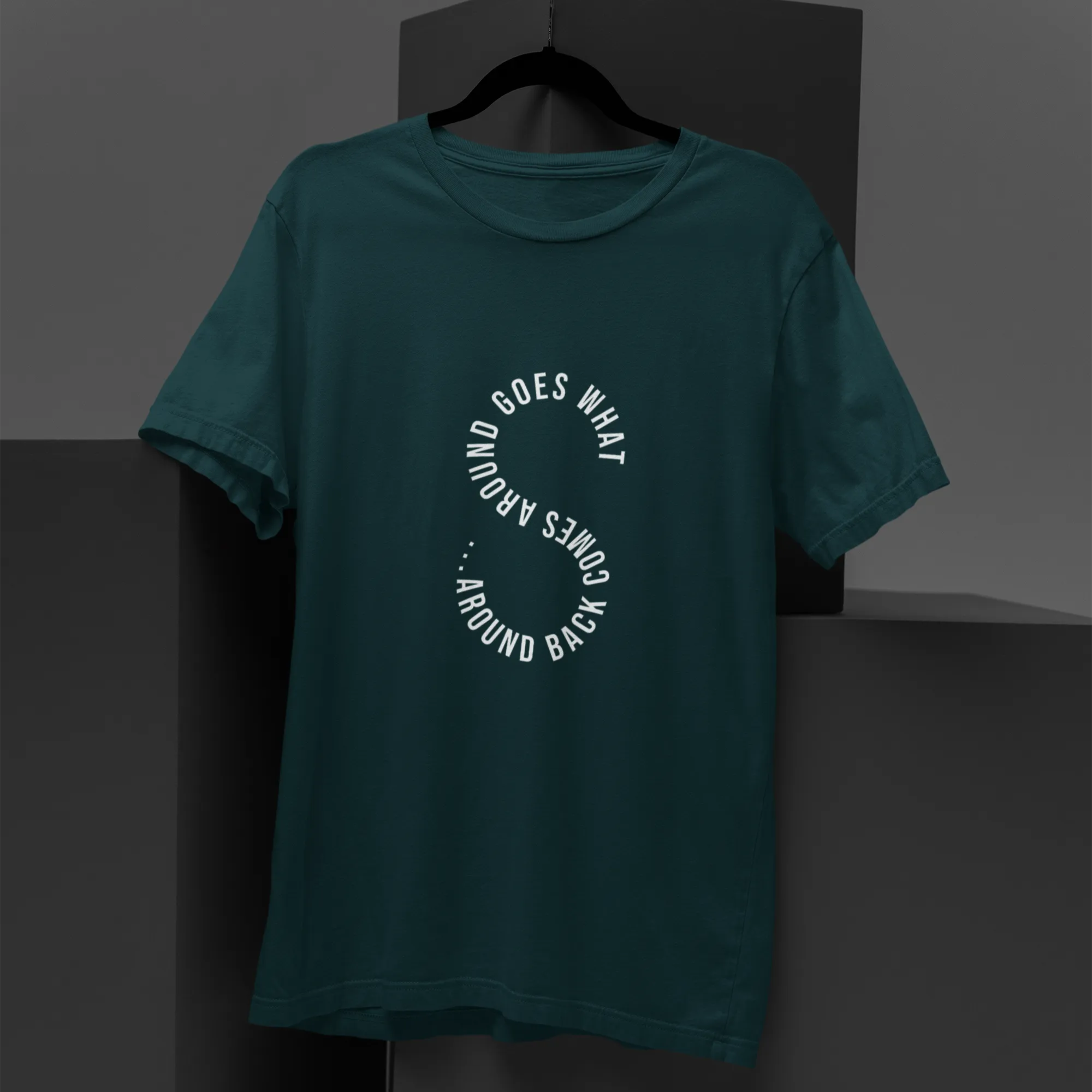Teal t-shirt with white text on a dark gray background