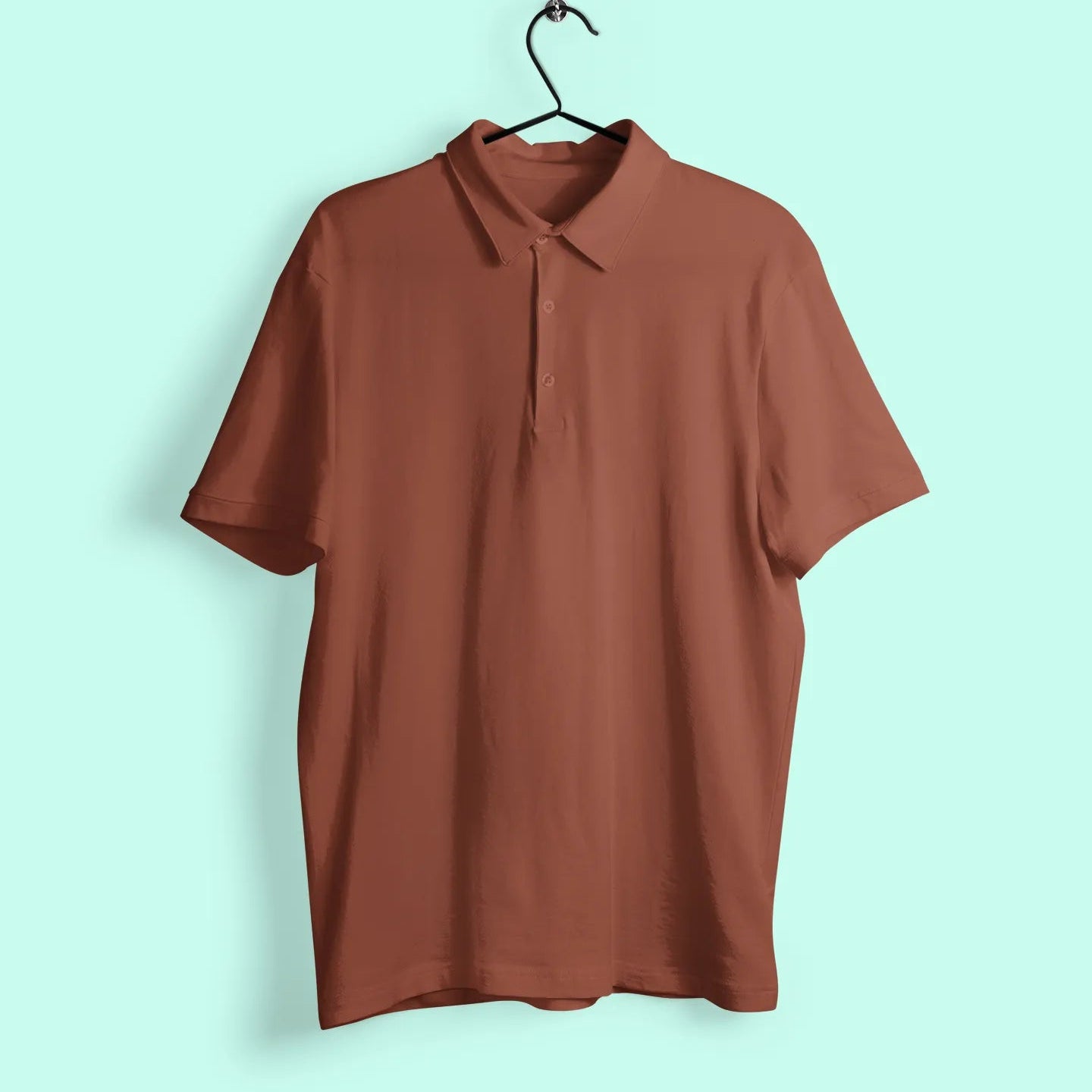 Brown polo shirt on a hanger against a light blue background