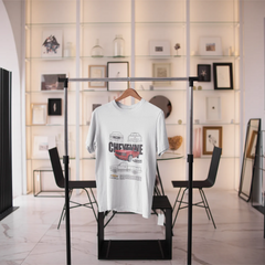 White t-shirt with graphic design on a black stand in a modern interior setting.