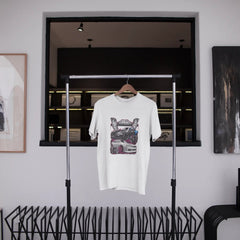 White t-shirt with graphic design hanging on a rack in a modern interior setting.