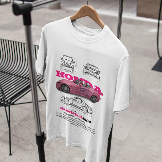 White t-shirt with car graphics on a hanger in a store setting