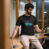 Two men in a casual setting, one using a phone and the other on a laptop.