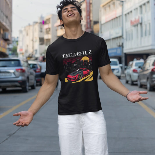 Man wearing a black t-shirt with graphic design on a city street