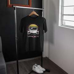 Black t-shirt with car graphic on a hanger in a room with a window.