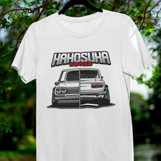 White t-shirt with a graphic design of a car and text 'Hahosuha' hanging outdoors.