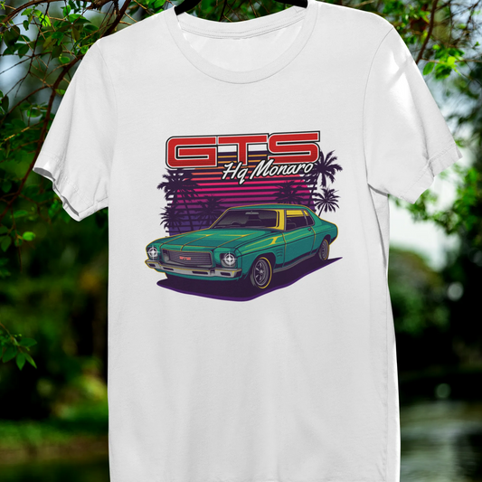 White t-shirt with a graphic of a vintage car and 'GTS' text, hanging outdoors.