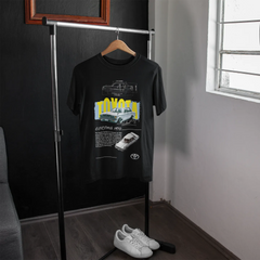 Black t-shirt with graphic design on a hanger next to a window
