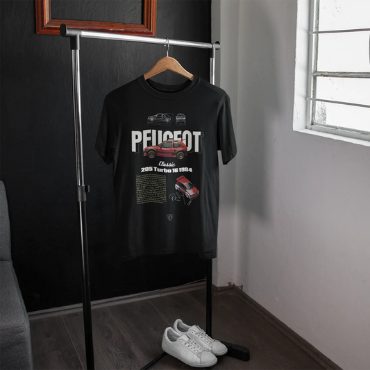 Black t-shirt with Peugeot logo on a hanger in a room with a window.