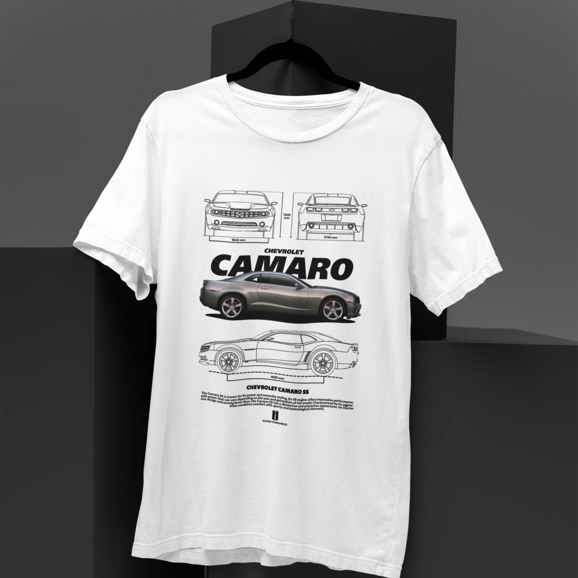 White t-shirt with black car illustrations and 'CAMARO' text on a dark background