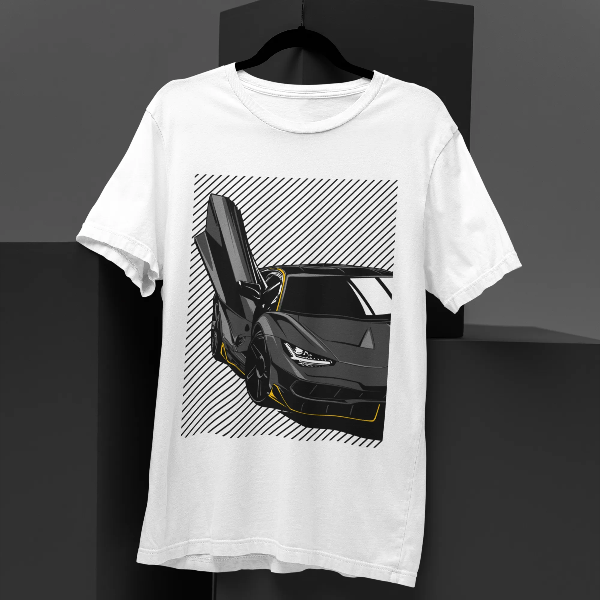 White t-shirt with a black sports car graphic on a dark background