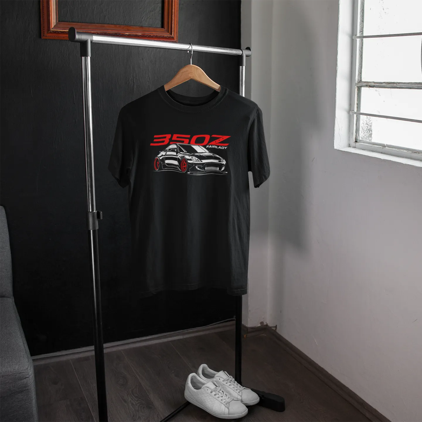 Black t-shirt with car graphic and '350Z' text on a hanger in a room with a window.