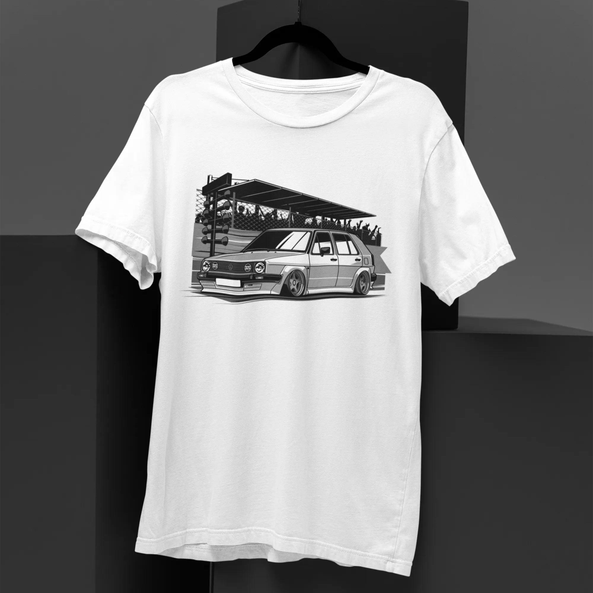 White t-shirt with a graphic of a car on a black background
