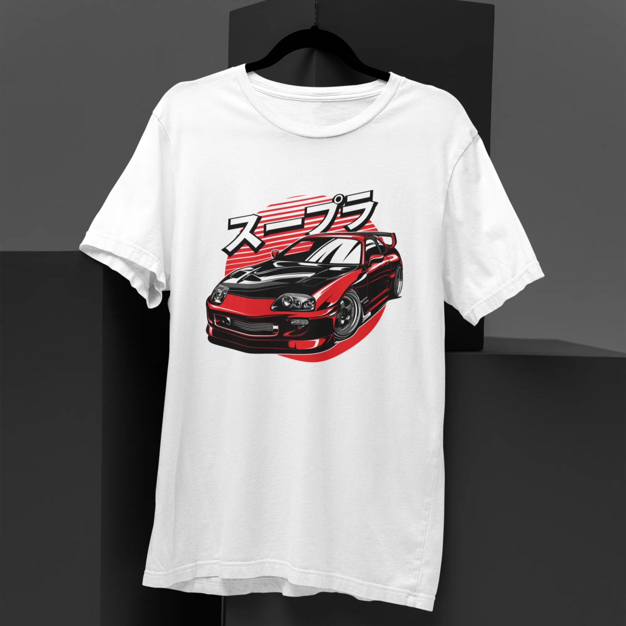 White t-shirt with a red and black car graphic and Japanese text on a dark background