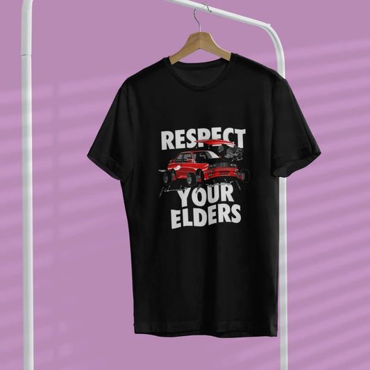 Black t-shirt with graphic design and text on a hanger against a purple background