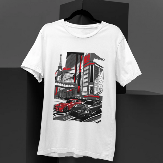 White t-shirt with a graphic design of cars and buildings on a black background