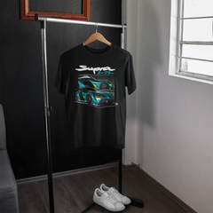 Black t-shirt with graphic design on a hanger in a room with a window.