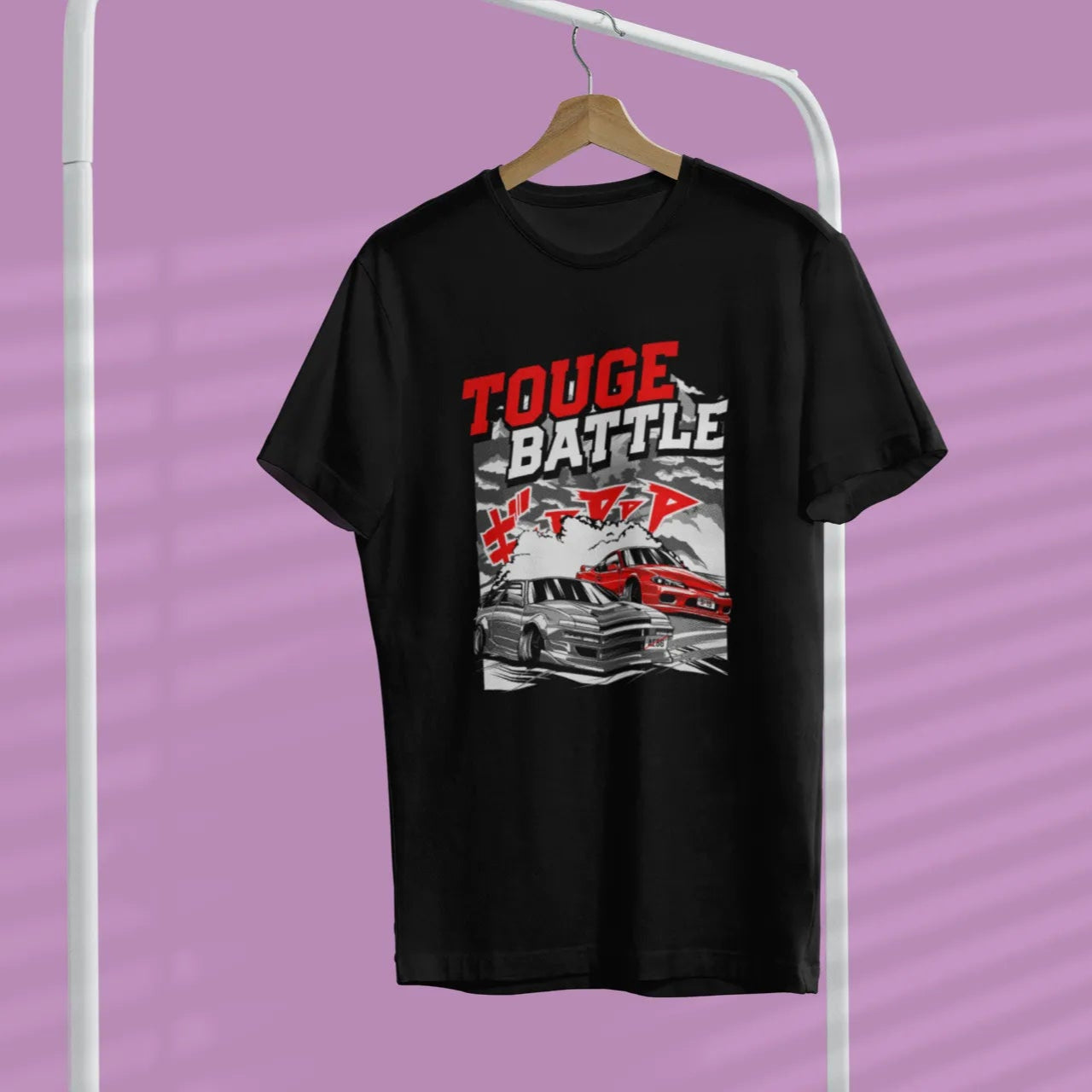 Black t-shirt with graphic design and text on a hanger against a purple background