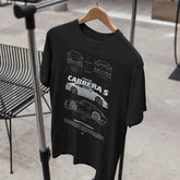 Black t-shirt with car design on a hanger against a neutral background