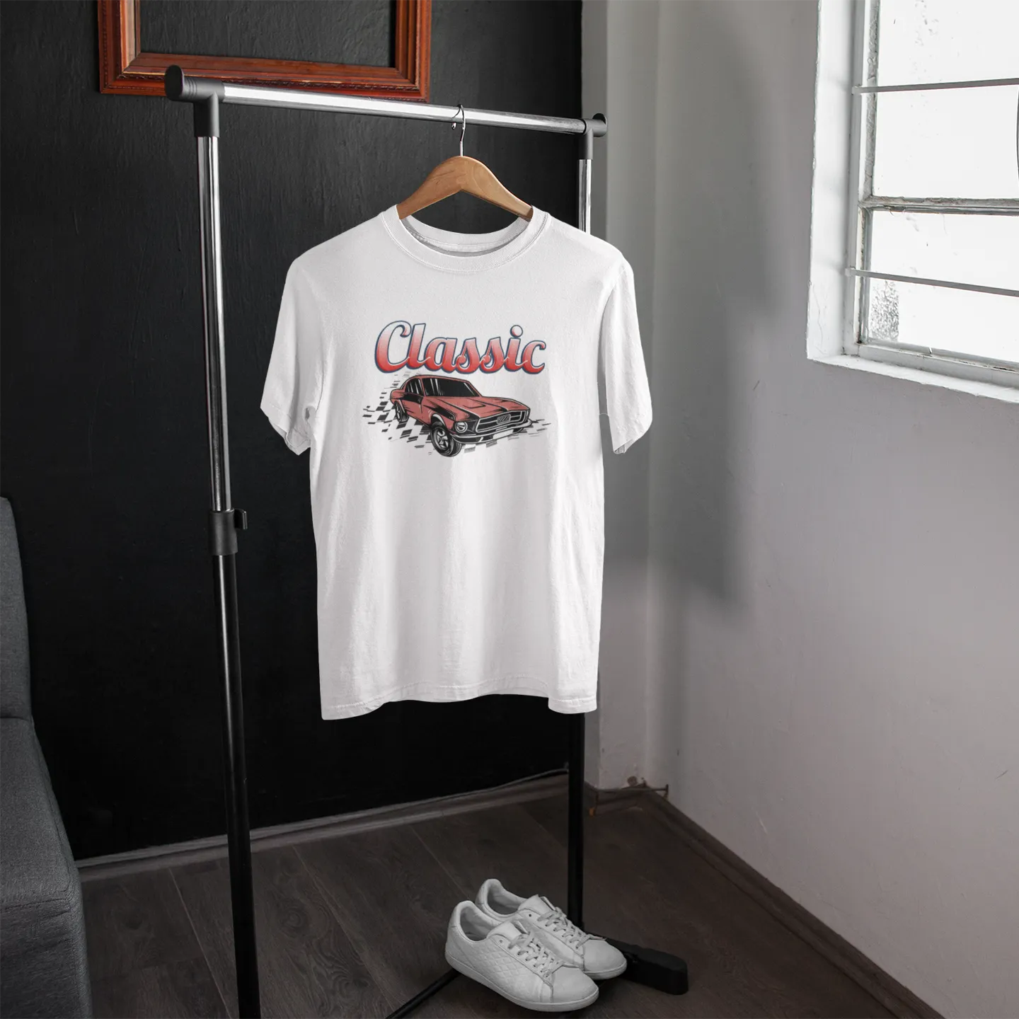 White t-shirt with a graphic design of a red car and 'Classic' text on a hanger in a room.