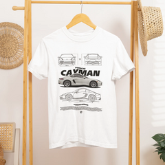 White t-shirt with car design hanging on a wooden rack.