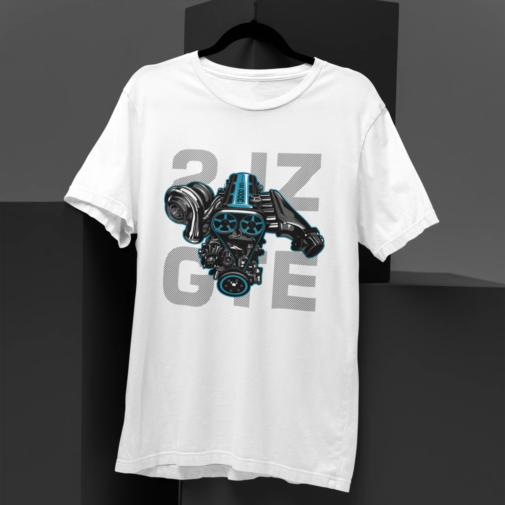 White t-shirt with engine graphic and text on a black background