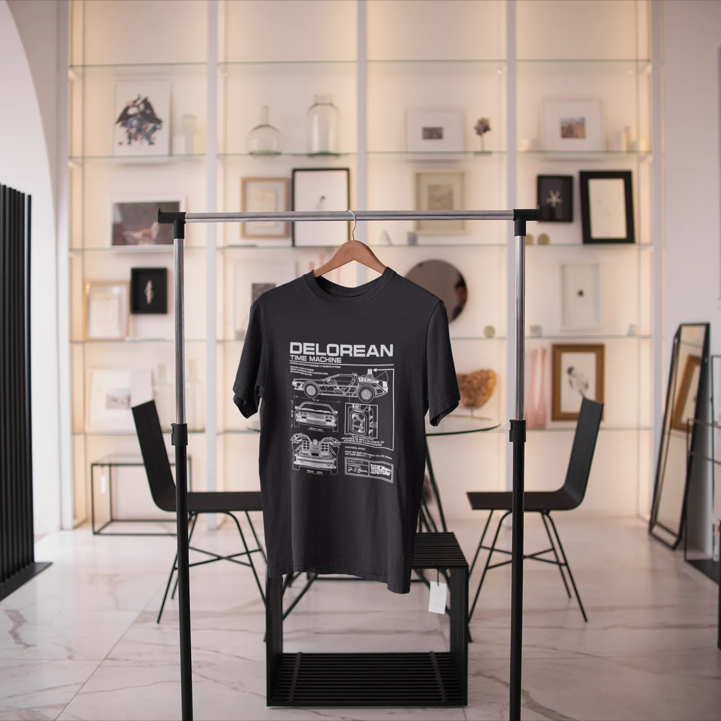Black t-shirt with 'DELOREAN' design on a stand in a modern interior setting.