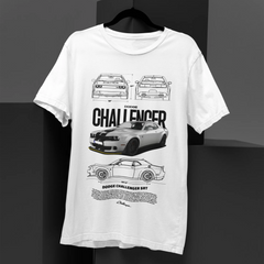 White t-shirt with car graphics and text on a black background